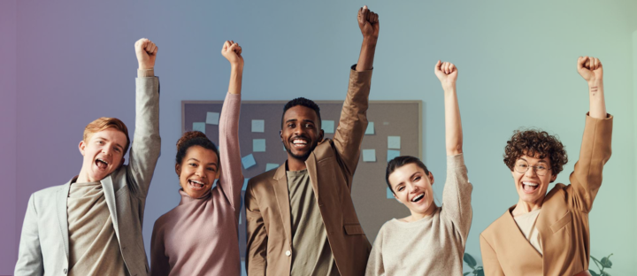 team celebrating in office