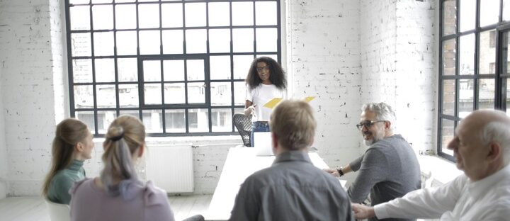 woman presenting in front of a class