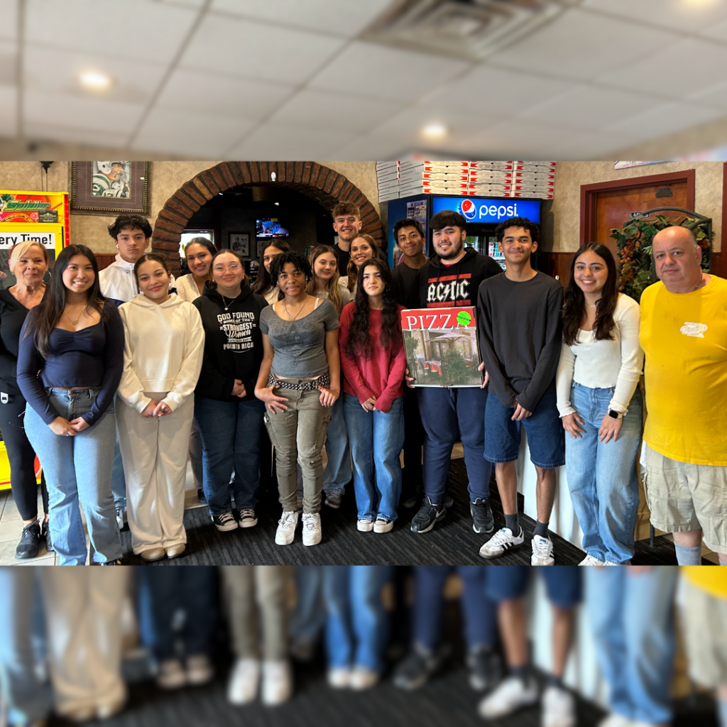 teens posing for photo in pizza parlor