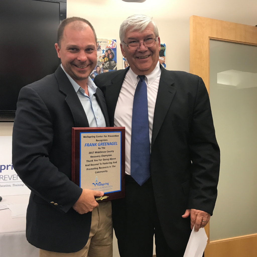 ezra helfand presents recovery champion award to frank greenagel