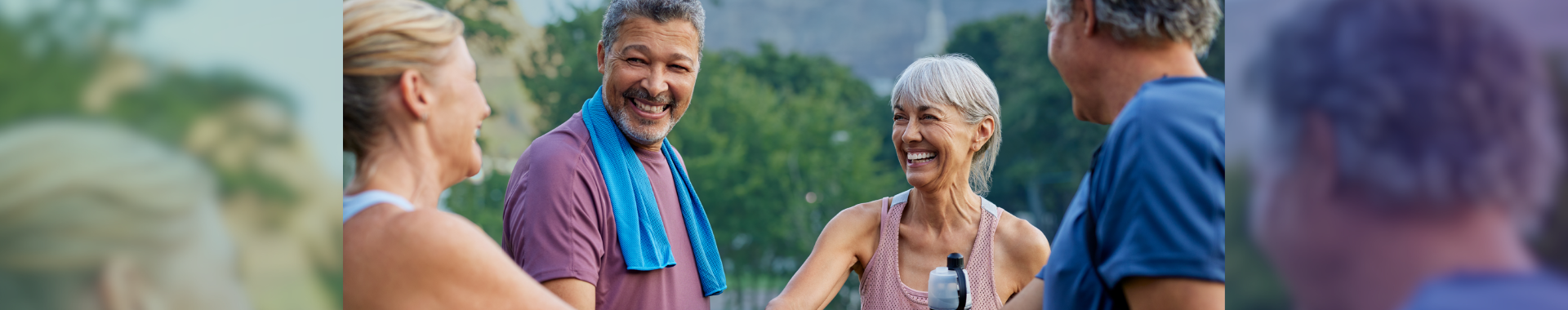 four happy senior citizens outside