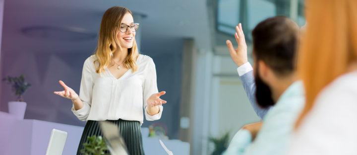 woman giving a presentation to office workers