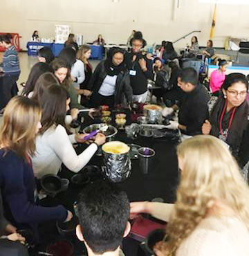 Participants connect around hands-on activities during the 2018 YWC.