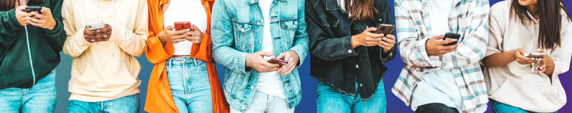 seven students using cell phones standing shoulder to shoulder