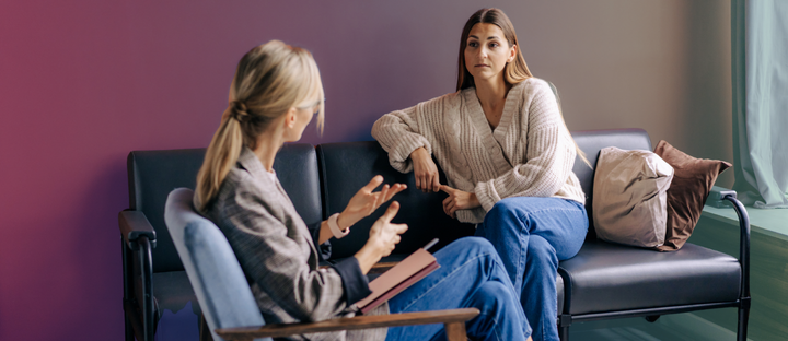 therapist speaking calmly with upset client